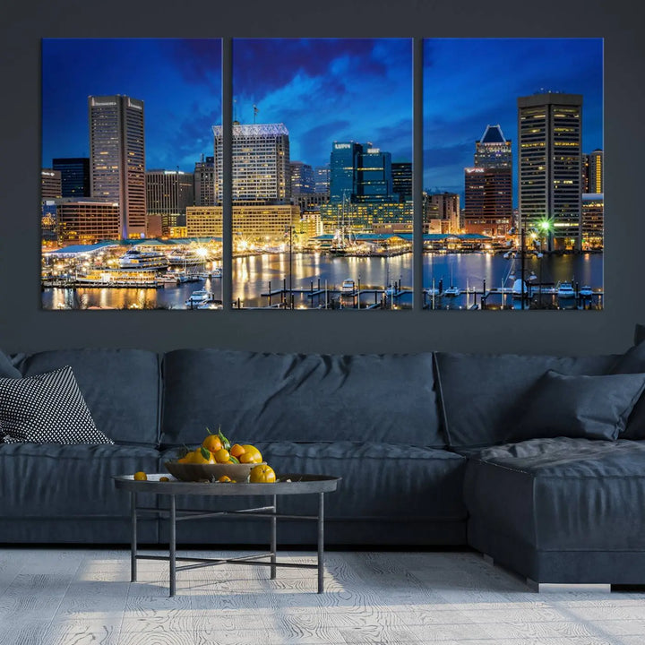 The living room features a nautical-themed triptych wall art on museum-quality canvas, showcasing the "Baltimore City Lights Night Cloudy Blue Skyline Cityscape View Wall Art Canvas Print.