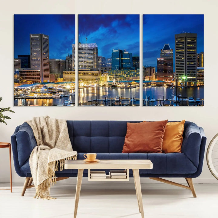 The living room features a nautical-themed triptych wall art on museum-quality canvas, showcasing the "Baltimore City Lights Night Cloudy Blue Skyline Cityscape View Wall Art Canvas Print.