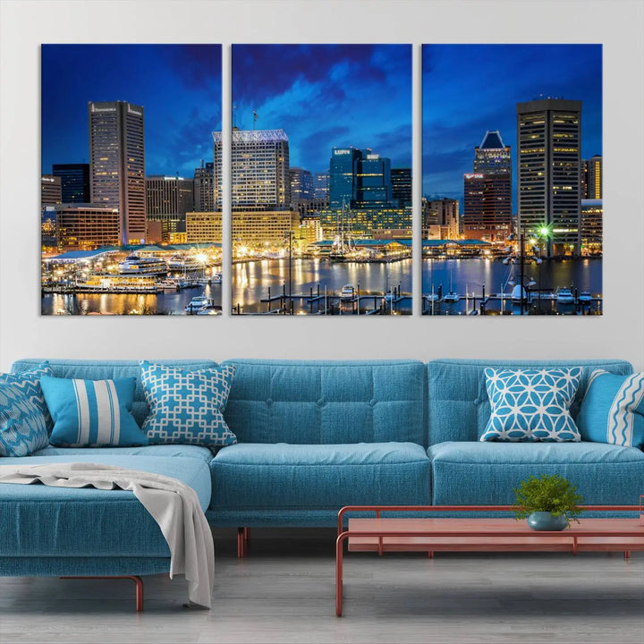 The living room features a nautical-themed triptych wall art on museum-quality canvas, showcasing the "Baltimore City Lights Night Cloudy Blue Skyline Cityscape View Wall Art Canvas Print.