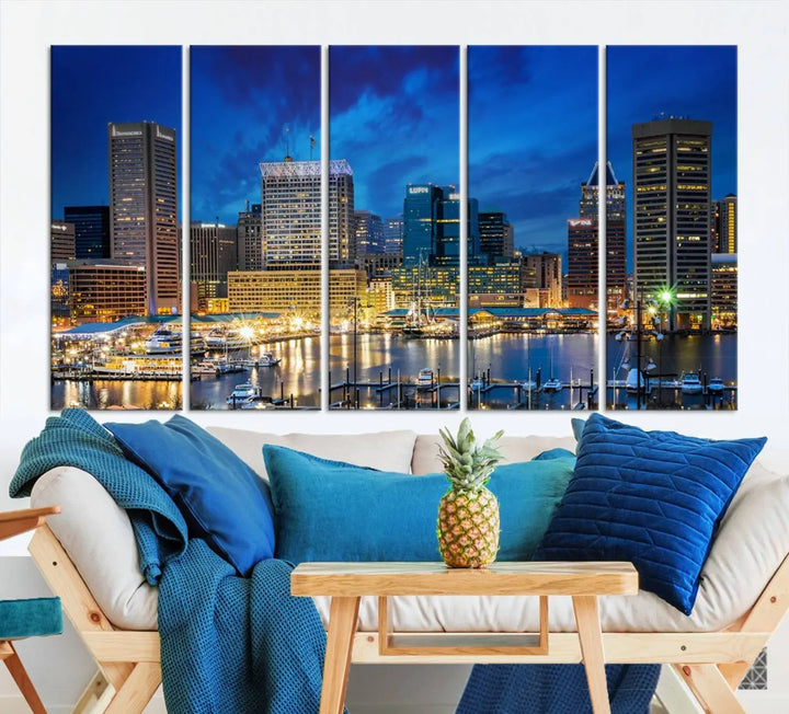 The living room features a nautical-themed triptych wall art on museum-quality canvas, showcasing the "Baltimore City Lights Night Cloudy Blue Skyline Cityscape View Wall Art Canvas Print.