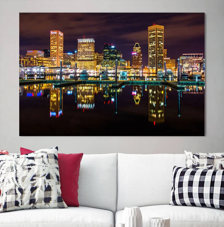 The Baltimore City Lights Night Purple Skyline Cityscape View Wall Art Canvas Print is a triptych showcasing a vibrant city skyline reflected on water. This artwork, crafted on museum-quality canvas and hand-assembled, adds sophistication and charm to any space while celebrating artistry made in the USA.