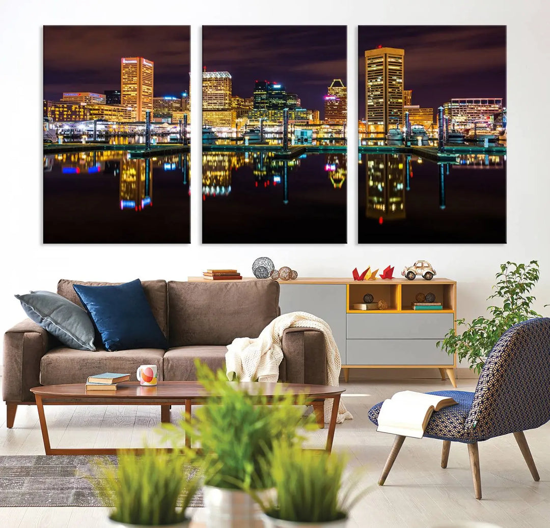 The Baltimore City Lights Night Purple Skyline Cityscape View Wall Art Canvas Print is a triptych showcasing a vibrant city skyline reflected on water. This artwork, crafted on museum-quality canvas and hand-assembled, adds sophistication and charm to any space while celebrating artistry made in the USA.