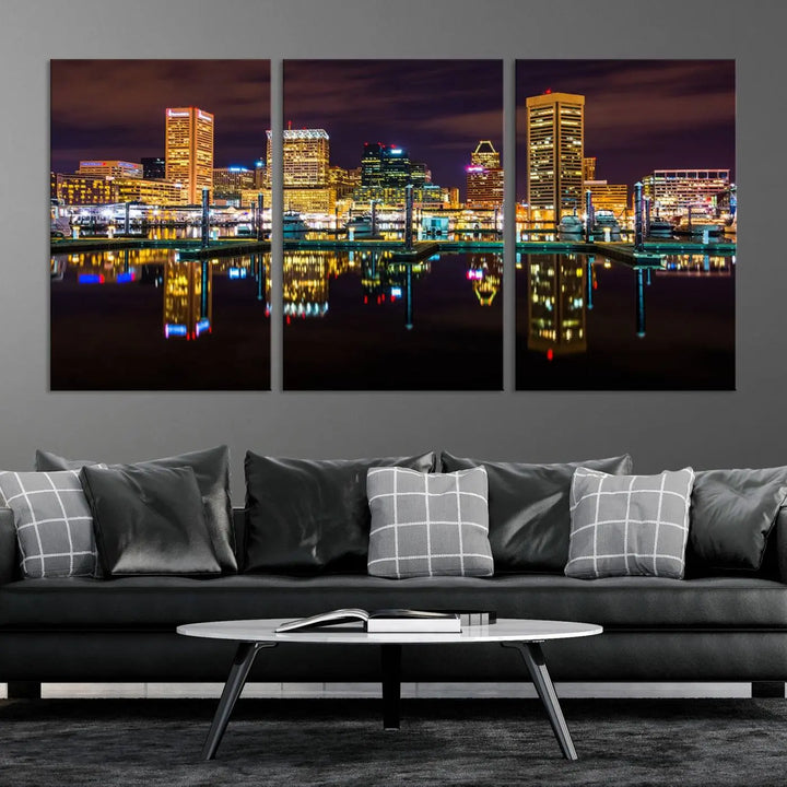 The Baltimore City Lights Night Purple Skyline Cityscape View Wall Art Canvas Print is a triptych showcasing a vibrant city skyline reflected on water. This artwork, crafted on museum-quality canvas and hand-assembled, adds sophistication and charm to any space while celebrating artistry made in the USA.