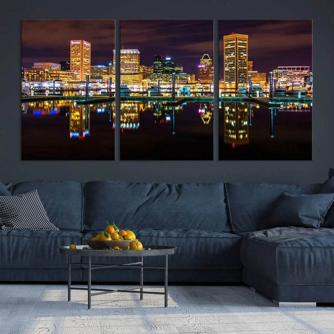 The Baltimore City Lights Night Purple Skyline Cityscape View Wall Art Canvas Print is a triptych showcasing a vibrant city skyline reflected on water. This artwork, crafted on museum-quality canvas and hand-assembled, adds sophistication and charm to any space while celebrating artistry made in the USA.