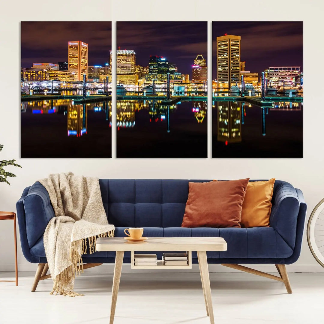 The Baltimore City Lights Night Purple Skyline Cityscape View Wall Art Canvas Print is a triptych showcasing a vibrant city skyline reflected on water. This artwork, crafted on museum-quality canvas and hand-assembled, adds sophistication and charm to any space while celebrating artistry made in the USA.