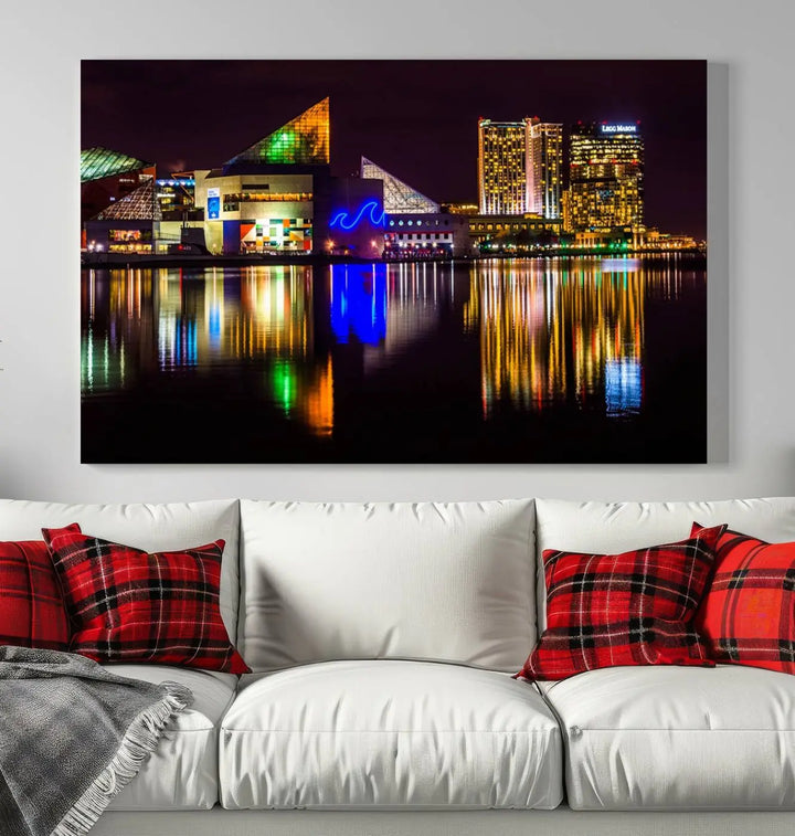 A set of museum-quality canvases featuring the "Baltimore City Lights Night Skyline Cityscape View Wall Art Canvas Print" showcases a vibrant nighttime cityscape with colorful reflections on water. The canvases are elegantly presented with gallery-wrapped edges for a polished look.