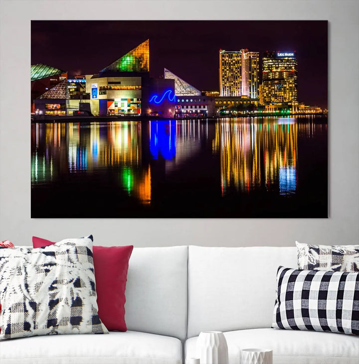 A set of museum-quality canvases featuring the "Baltimore City Lights Night Skyline Cityscape View Wall Art Canvas Print" showcases a vibrant nighttime cityscape with colorful reflections on water. The canvases are elegantly presented with gallery-wrapped edges for a polished look.