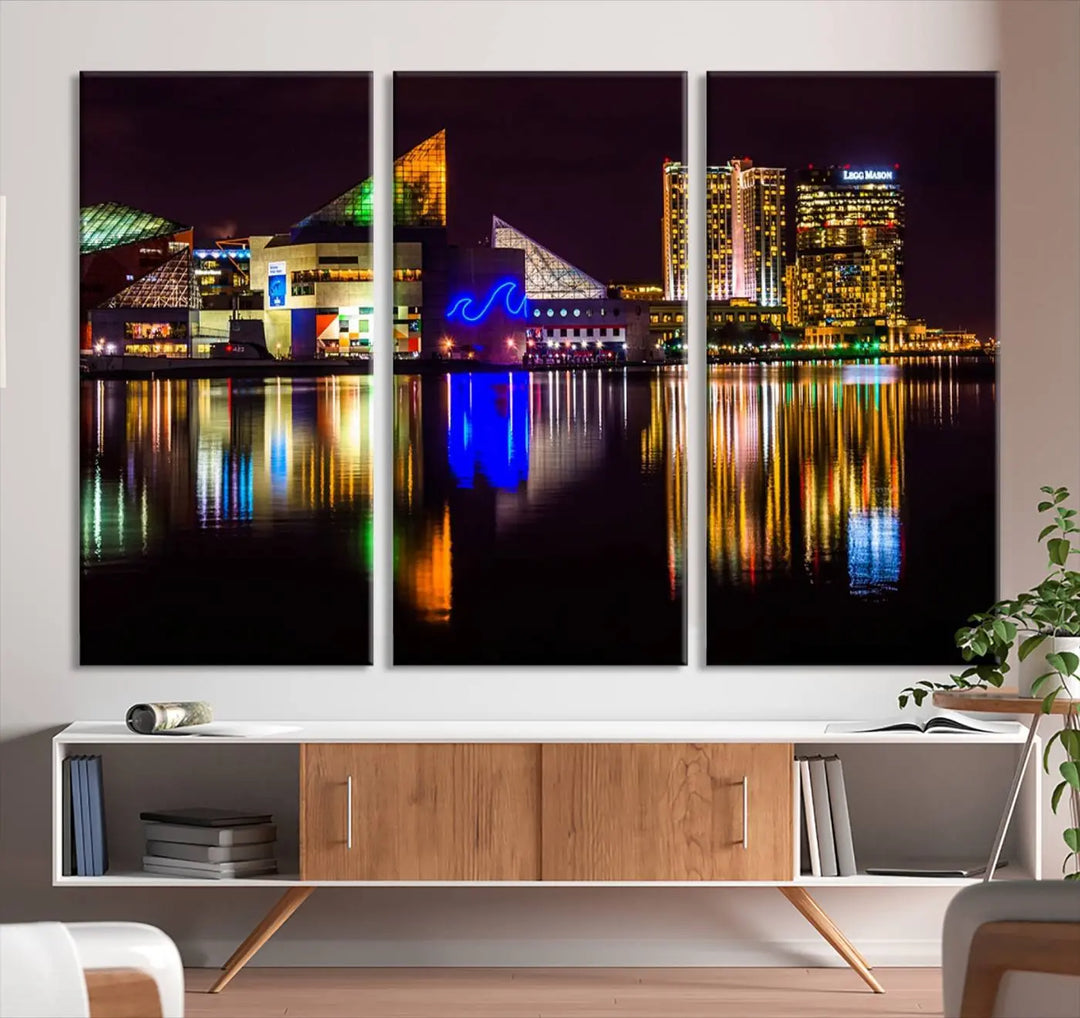 A set of museum-quality canvases featuring the "Baltimore City Lights Night Skyline Cityscape View Wall Art Canvas Print" showcases a vibrant nighttime cityscape with colorful reflections on water. The canvases are elegantly presented with gallery-wrapped edges for a polished look.