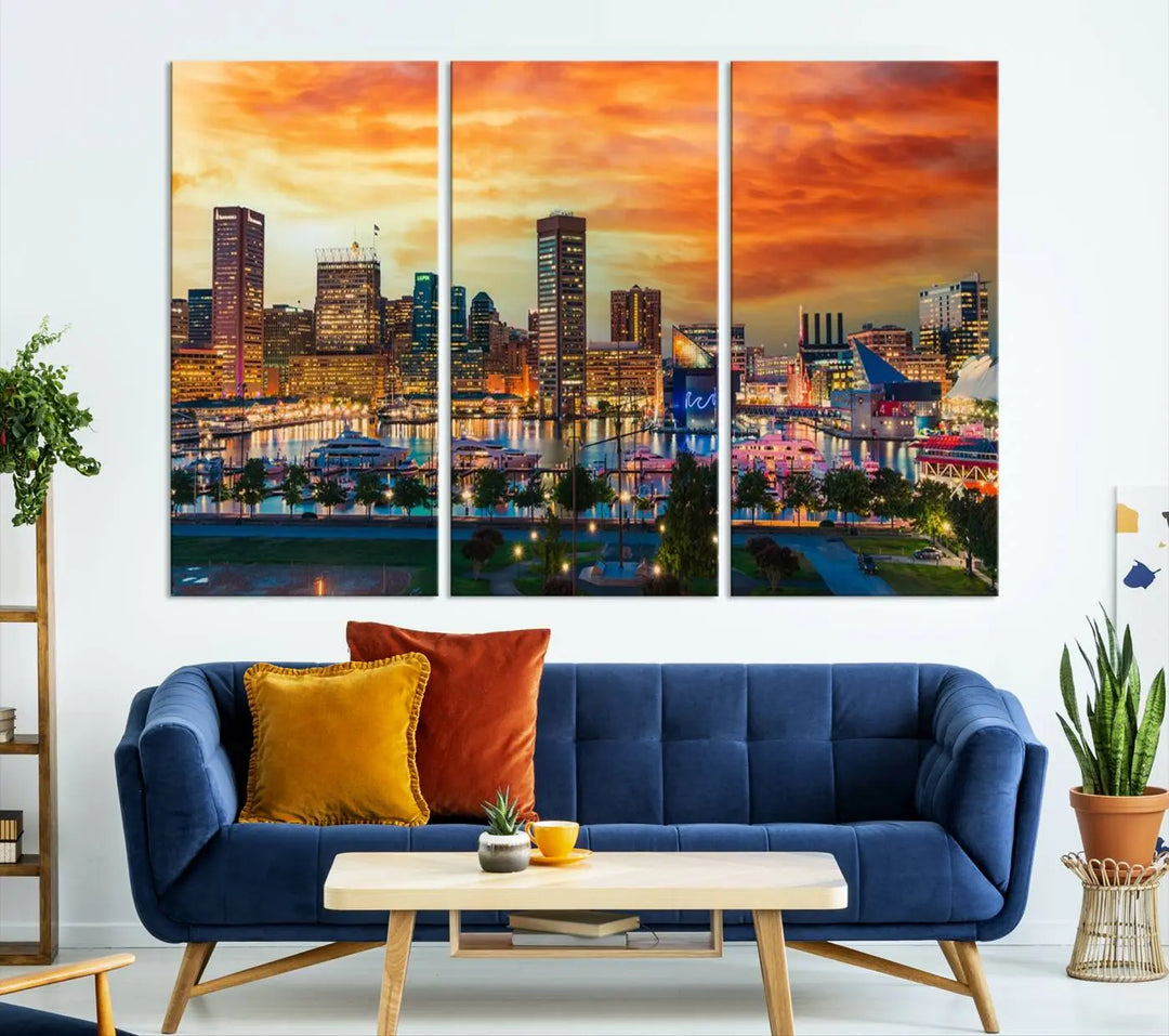 The living room features the Baltimore City Lights Sunset Orange Skyline Cityscape View Wall Art Canvas Print. This vibrant skyline masterpiece is professionally hand-assembled on museum-quality canvases and treated with a UV-protective coating for lasting beauty.