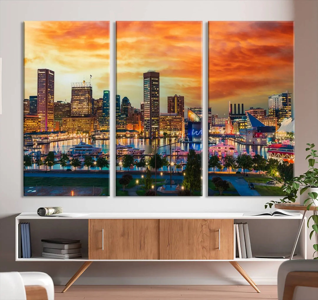 The living room features the Baltimore City Lights Sunset Orange Skyline Cityscape View Wall Art Canvas Print. This vibrant skyline masterpiece is professionally hand-assembled on museum-quality canvases and treated with a UV-protective coating for lasting beauty.