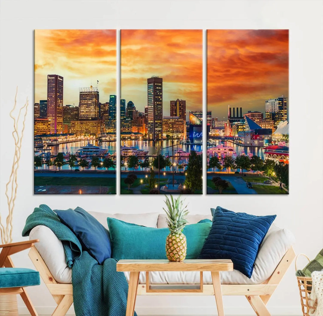 The living room features the Baltimore City Lights Sunset Orange Skyline Cityscape View Wall Art Canvas Print. This vibrant skyline masterpiece is professionally hand-assembled on museum-quality canvases and treated with a UV-protective coating for lasting beauty.