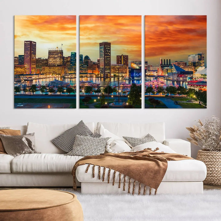 The living room features the Baltimore City Lights Sunset Orange Skyline Cityscape View Wall Art Canvas Print. This vibrant skyline masterpiece is professionally hand-assembled on museum-quality canvases and treated with a UV-protective coating for lasting beauty.