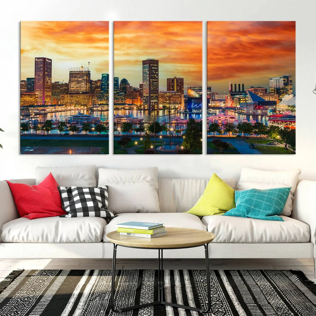 The living room features the Baltimore City Lights Sunset Orange Skyline Cityscape View Wall Art Canvas Print. This vibrant skyline masterpiece is professionally hand-assembled on museum-quality canvases and treated with a UV-protective coating for lasting beauty.