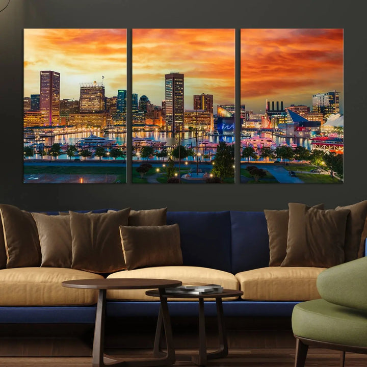 The living room features the Baltimore City Lights Sunset Orange Skyline Cityscape View Wall Art Canvas Print. This vibrant skyline masterpiece is professionally hand-assembled on museum-quality canvases and treated with a UV-protective coating for lasting beauty.