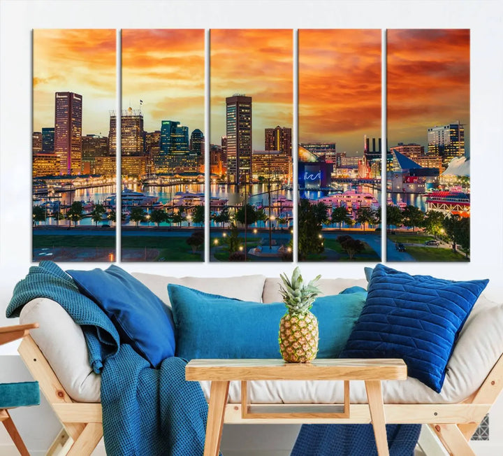 The living room features the Baltimore City Lights Sunset Orange Skyline Cityscape View Wall Art Canvas Print. This vibrant skyline masterpiece is professionally hand-assembled on museum-quality canvases and treated with a UV-protective coating for lasting beauty.