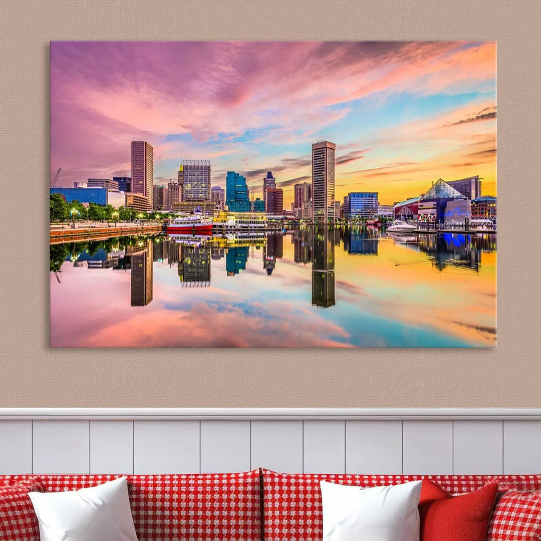 The Baltimore City Lights Sunset Pink and Orange Skyline canvas print depicts a vibrant cityscape at sunset, with skyscrapers reflecting in a calm river on museum-quality canvas. Each piece is gallery wrapped and features a UV-protective coating.