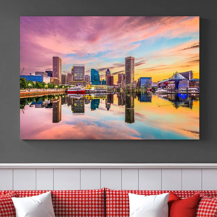 The Baltimore City Lights Sunset Pink and Orange Skyline canvas print depicts a vibrant cityscape at sunset, with skyscrapers reflecting in a calm river on museum-quality canvas. Each piece is gallery wrapped and features a UV-protective coating.