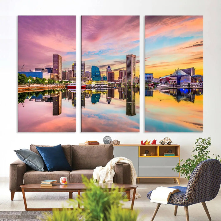 The Baltimore City Lights Sunset Pink and Orange Skyline canvas print depicts a vibrant cityscape at sunset, with skyscrapers reflecting in a calm river on museum-quality canvas. Each piece is gallery wrapped and features a UV-protective coating.