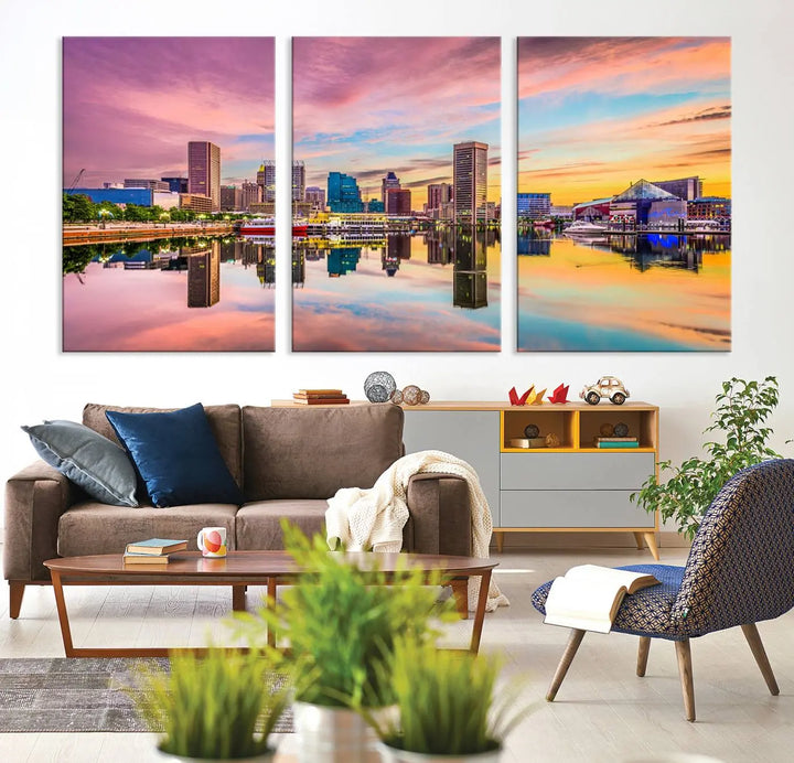 The Baltimore City Lights Sunset Pink and Orange Skyline canvas print depicts a vibrant cityscape at sunset, with skyscrapers reflecting in a calm river on museum-quality canvas. Each piece is gallery wrapped and features a UV-protective coating.