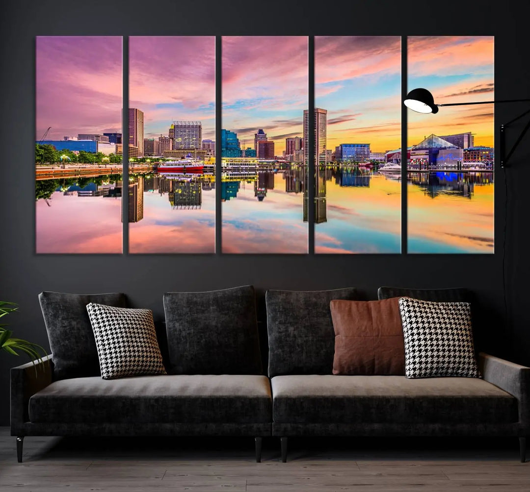 The Baltimore City Lights Sunset Pink and Orange Skyline canvas print depicts a vibrant cityscape at sunset, with skyscrapers reflecting in a calm river on museum-quality canvas. Each piece is gallery wrapped and features a UV-protective coating.