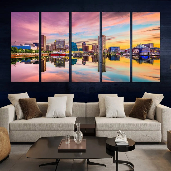 The Baltimore City Lights Sunset Pink and Orange Skyline canvas print depicts a vibrant cityscape at sunset, with skyscrapers reflecting in a calm river on museum-quality canvas. Each piece is gallery wrapped and features a UV-protective coating.