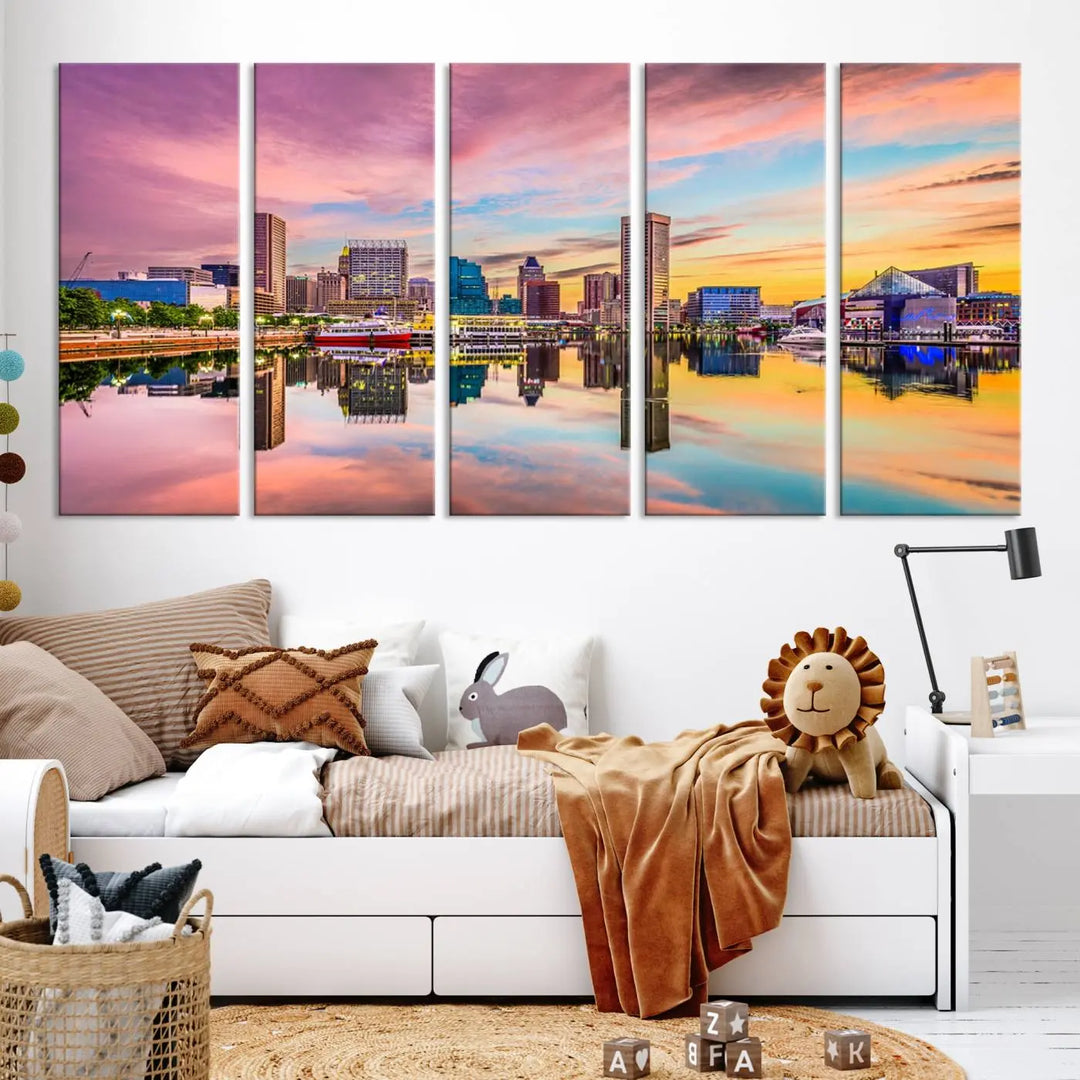 The Baltimore City Lights Sunset Pink and Orange Skyline canvas print depicts a vibrant cityscape at sunset, with skyscrapers reflecting in a calm river on museum-quality canvas. Each piece is gallery wrapped and features a UV-protective coating.