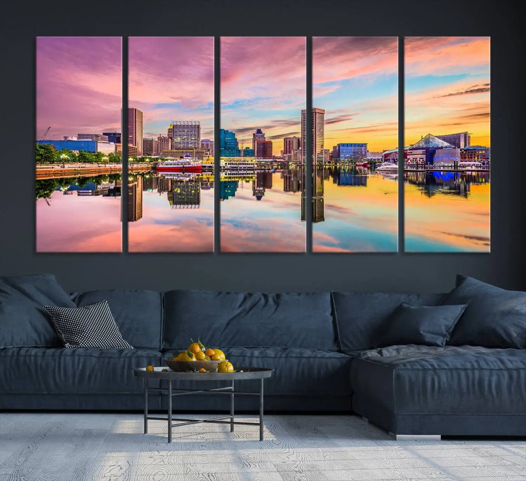 The Baltimore City Lights Sunset Pink and Orange Skyline canvas print depicts a vibrant cityscape at sunset, with skyscrapers reflecting in a calm river on museum-quality canvas. Each piece is gallery wrapped and features a UV-protective coating.