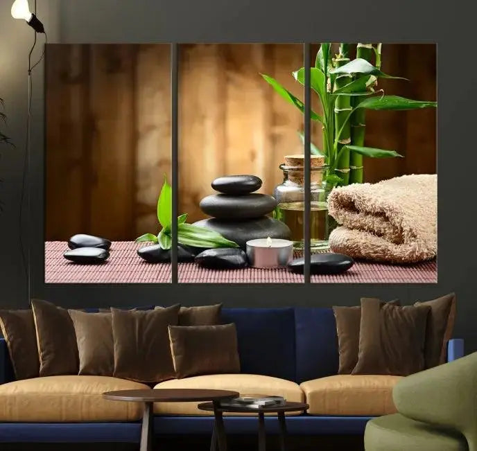 An inspiring Wall Art Canvas Print depicts a tranquil spa scene with Zen Stones and bamboo against the backdrop of a cozy living room.