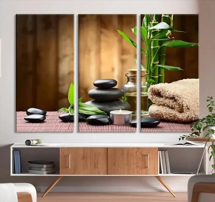 An inspiring Wall Art Canvas Print depicts a tranquil spa scene with Zen Stones and bamboo against the backdrop of a cozy living room.