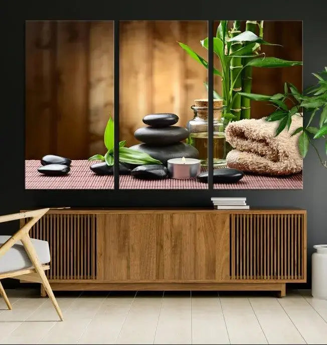 An inspiring Wall Art Canvas Print depicts a tranquil spa scene with Zen Stones and bamboo against the backdrop of a cozy living room.