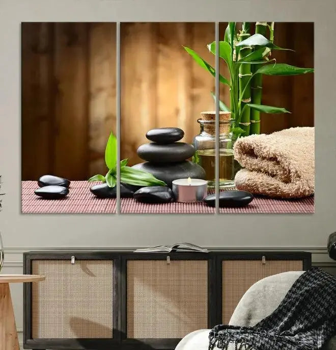 An inspiring Wall Art Canvas Print depicts a tranquil spa scene with Zen Stones and bamboo against the backdrop of a cozy living room.