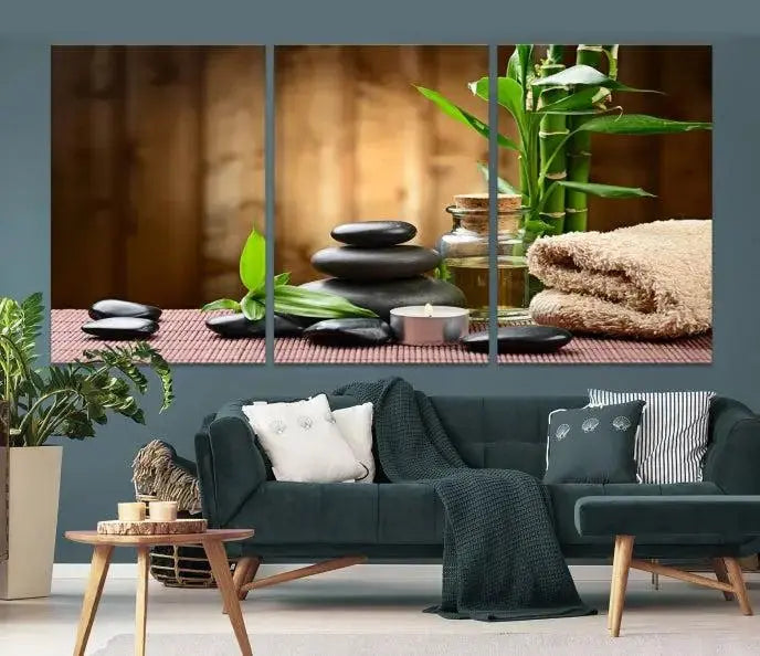 An inspiring Wall Art Canvas Print depicts a tranquil spa scene with Zen Stones and bamboo against the backdrop of a cozy living room.