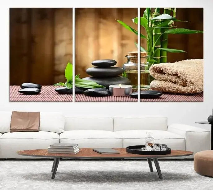 An inspiring Wall Art Canvas Print depicts a tranquil spa scene with Zen Stones and bamboo against the backdrop of a cozy living room.