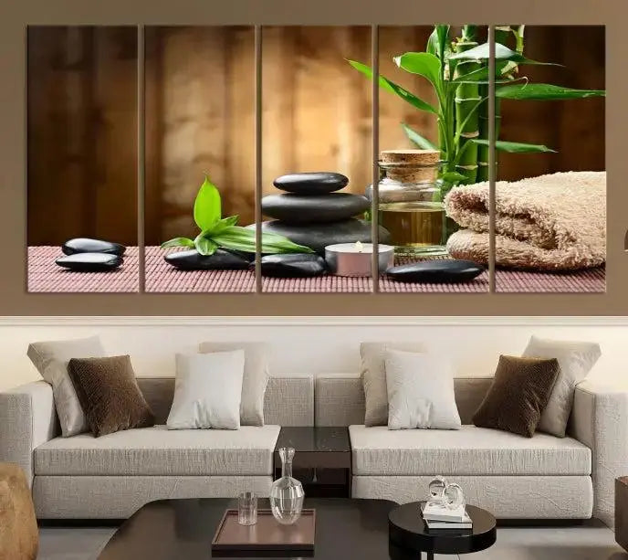 An inspiring Wall Art Canvas Print depicts a tranquil spa scene with Zen Stones and bamboo against the backdrop of a cozy living room.