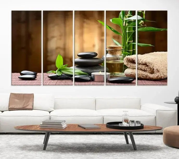 An inspiring Wall Art Canvas Print depicts a tranquil spa scene with Zen Stones and bamboo against the backdrop of a cozy living room.