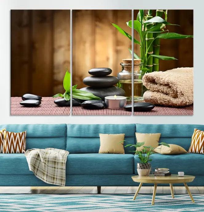 An inspiring Wall Art Canvas Print depicts a tranquil spa scene with Zen Stones and bamboo against the backdrop of a cozy living room.