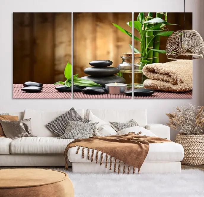 An inspiring Wall Art Canvas Print depicts a tranquil spa scene with Zen Stones and bamboo against the backdrop of a cozy living room.