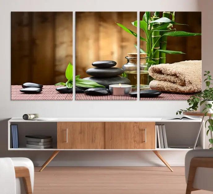 An inspiring Wall Art Canvas Print depicts a tranquil spa scene with Zen Stones and bamboo against the backdrop of a cozy living room.