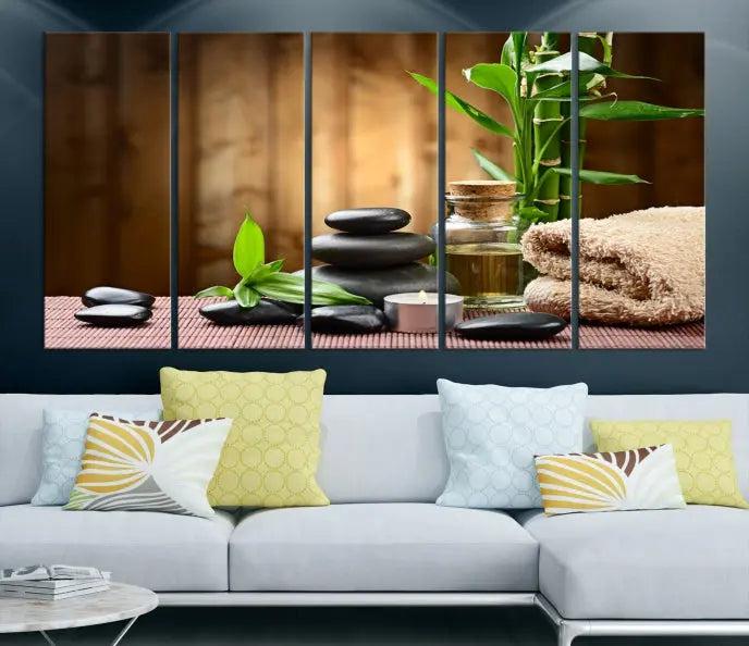 An inspiring Wall Art Canvas Print depicts a tranquil spa scene with Zen Stones and bamboo against the backdrop of a cozy living room.