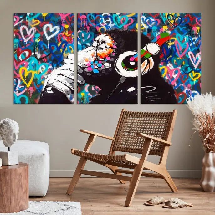 A triptych featuring the "Banksy Canvas Wall Art Thinking Monkey Canvas Art Print" showcases a chimp wearing headphones against a colorful heart-patterned background. Each museum-quality canvas is gallery wrapped and finished with a UV-protective coating to ensure lasting brilliance.