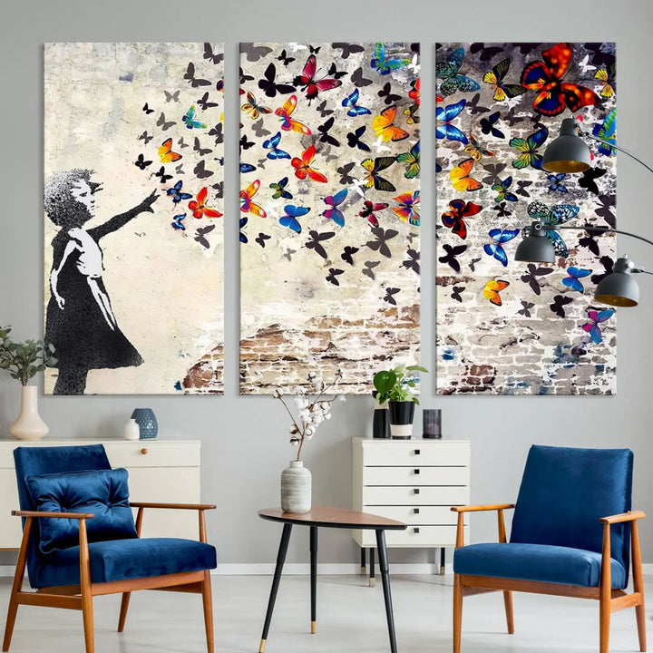 The Banksy Graffiti Wall Art Canvas Print, entitled 'Girl Releasing Vibrant Butterflies,' is a three-panel piece that is ready to hang.