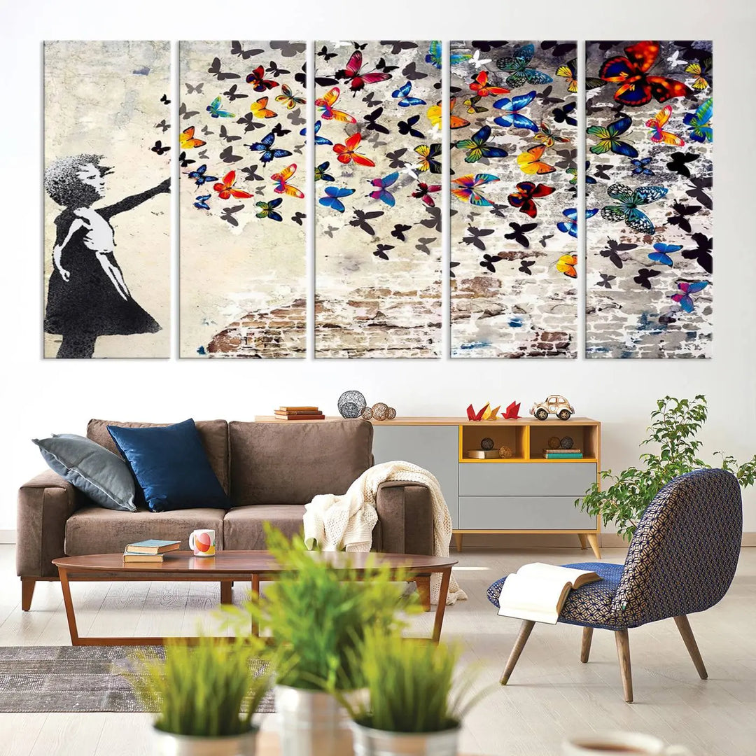 The Banksy Graffiti Wall Art Canvas Print, entitled 'Girl Releasing Vibrant Butterflies,' is a three-panel piece that is ready to hang.