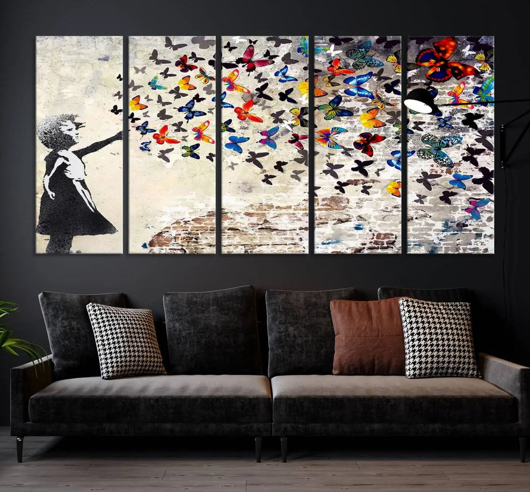 The Banksy Graffiti Wall Art Canvas Print, entitled 'Girl Releasing Vibrant Butterflies,' is a three-panel piece that is ready to hang.