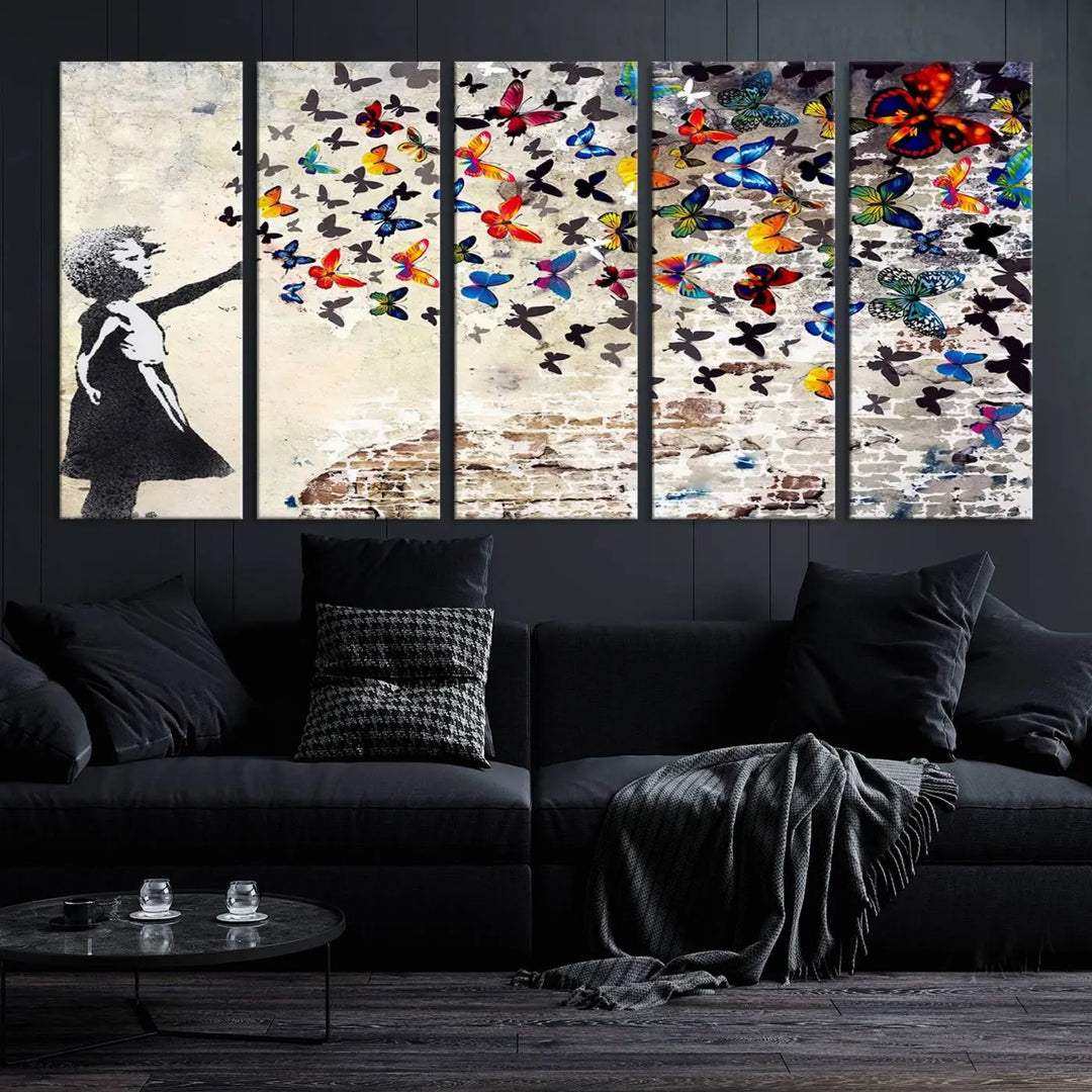 The Banksy Graffiti Wall Art Canvas Print, entitled 'Girl Releasing Vibrant Butterflies,' is a three-panel piece that is ready to hang.