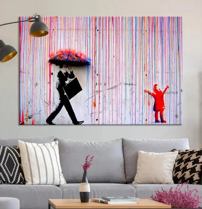 Introducing the Banksy Street Art Wall Art Canvas Print, a captivating piece featuring modern art of a man with an umbrella while a child reaches up through vibrant drips. Its premium canvas and gallery-quality finish make it an eye-catching addition to any space.