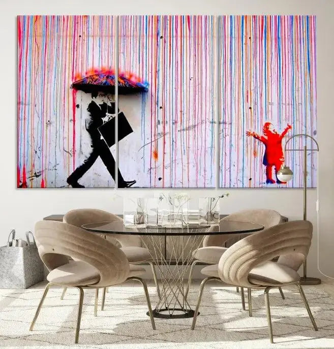 Introducing the Banksy Street Art Wall Art Canvas Print, a captivating piece featuring modern art of a man with an umbrella while a child reaches up through vibrant drips. Its premium canvas and gallery-quality finish make it an eye-catching addition to any space.