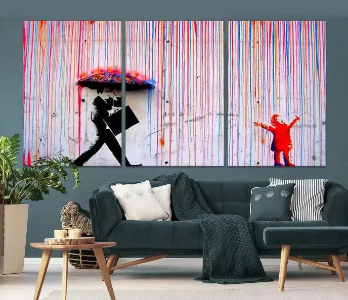 Introducing the Banksy Street Art Wall Art Canvas Print, a captivating piece featuring modern art of a man with an umbrella while a child reaches up through vibrant drips. Its premium canvas and gallery-quality finish make it an eye-catching addition to any space.