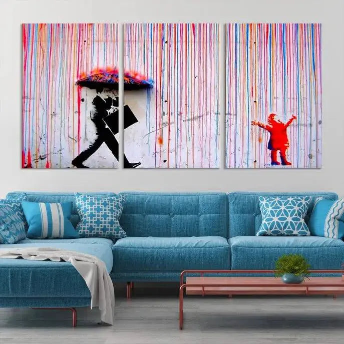 Introducing the Banksy Street Art Wall Art Canvas Print, a captivating piece featuring modern art of a man with an umbrella while a child reaches up through vibrant drips. Its premium canvas and gallery-quality finish make it an eye-catching addition to any space.