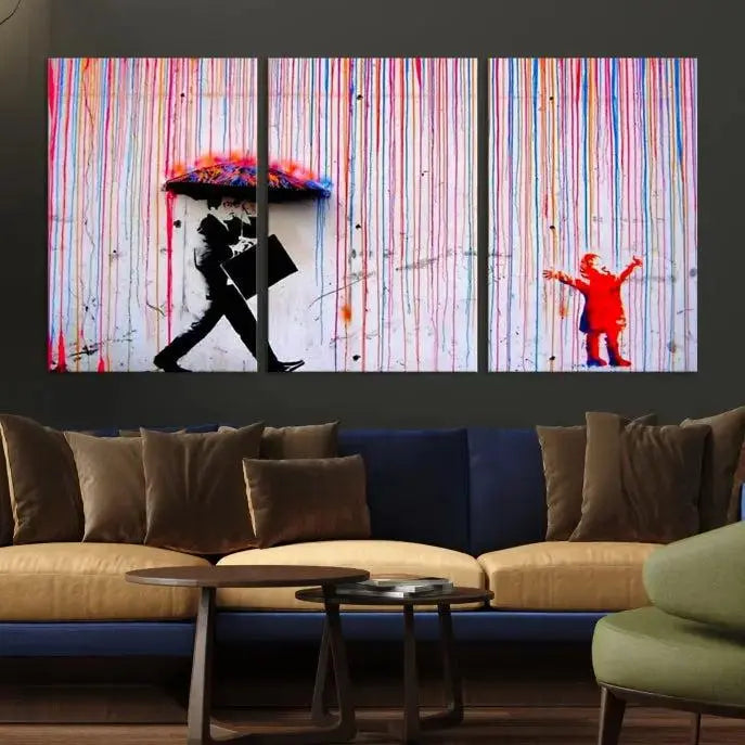 Introducing the Banksy Street Art Wall Art Canvas Print, a captivating piece featuring modern art of a man with an umbrella while a child reaches up through vibrant drips. Its premium canvas and gallery-quality finish make it an eye-catching addition to any space.