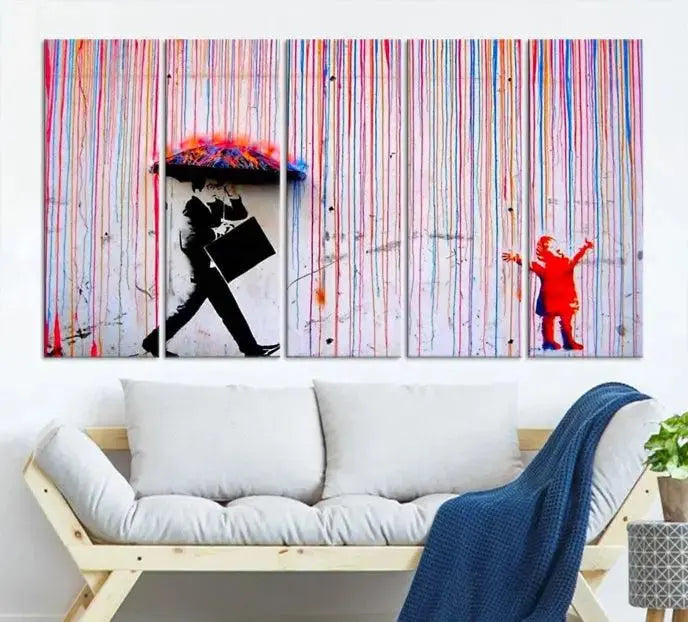 Introducing the Banksy Street Art Wall Art Canvas Print, a captivating piece featuring modern art of a man with an umbrella while a child reaches up through vibrant drips. Its premium canvas and gallery-quality finish make it an eye-catching addition to any space.